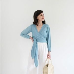 Sustainable, ethically made Thea Wrap Blouse by EMLEE in Sky Blue. Size small.